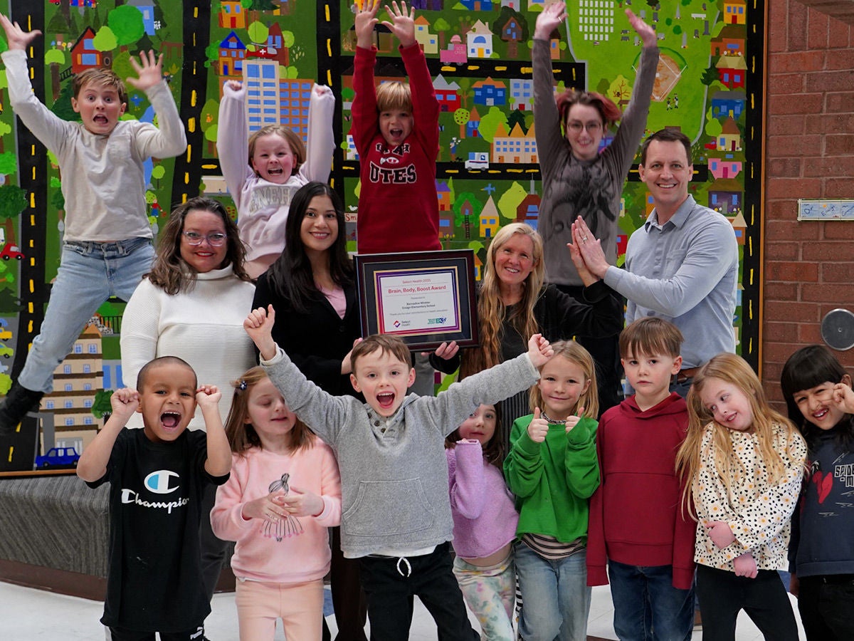 Jumping Kids B3 Kids pictures and Award Picture of classroom jumping and SH showing an award with teachers