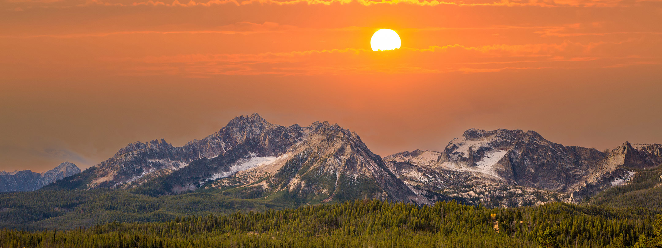 Landscape photo of a sunset over the Idaho Sawtooth mountains.